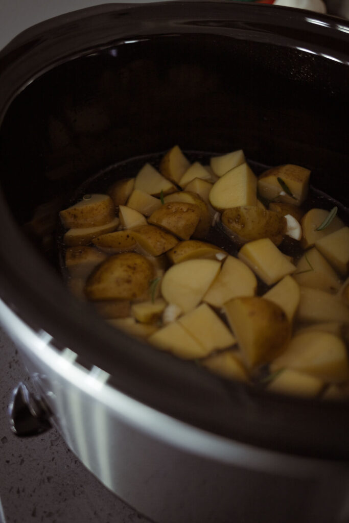 cut up potatoes in a slow cooker