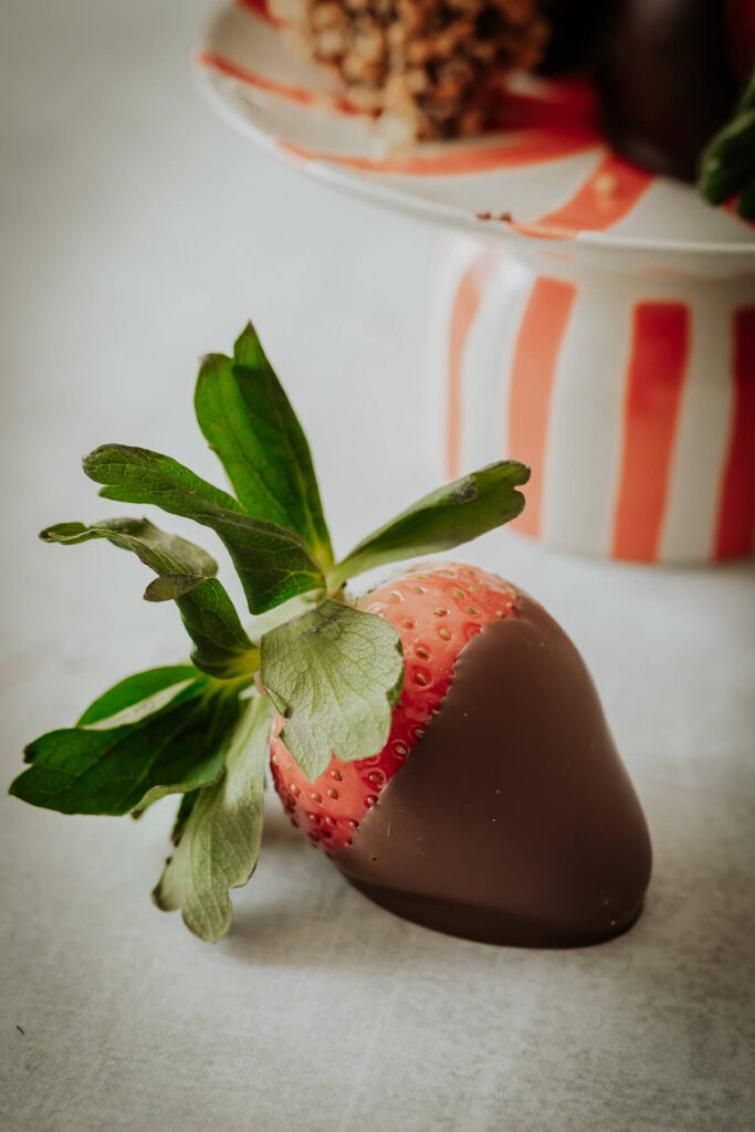 close up view of chocolate covered strawberry - get the recipe inside!