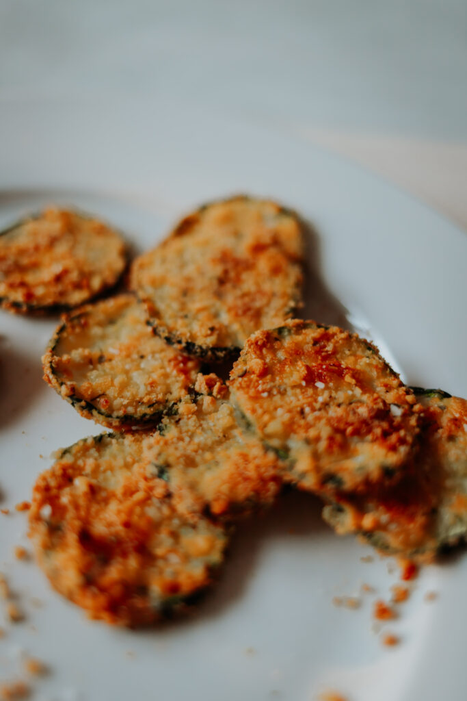 close up view of golden gluten free breaded zucchini